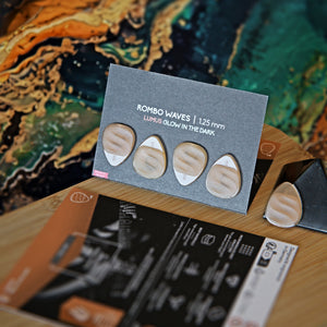Guitar Pick Set Variety Pack Rombo (4 Guitar Picks) in the material Velvet Touch Lumus. Warmer tones, glow in the dark, and hand-polished in Germany.