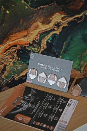 Guitar Pick Set Shell (4 Guitar Picks) in the material Velvet Touch Lumus. Warmer tones, glow in the dark, and hand-polished in Germany.